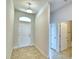 Clean entryway with tile floor, neutral walls, and access to bathroom at 237 Piave St, Haines City, FL 33844