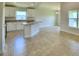 Open kitchen with island and light tile flooring at 237 Piave St, Haines City, FL 33844