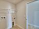 Laundry room with shelving and access to another room at 237 Piave St, Haines City, FL 33844