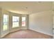 Bright bedroom with bay window and neutral carpeting at 245 Piave St, Haines City, FL 33844