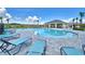 Community pool with lounge chairs and cabana at 245 Piave St, Haines City, FL 33844