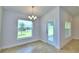 Bright dining room with chandelier and access to backyard at 245 Piave St, Haines City, FL 33844