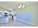 Casual dining area with chandelier and view into kitchen at 245 Piave St, Haines City, FL 33844