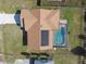 Aerial view of home with solar panels, pool, and fenced backyard at 3220 Cherry Hill S Cir, Lakeland, FL 33810