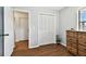 Bedroom with closet, dresser, and hardwood floor at 3220 Cherry Hill S Cir, Lakeland, FL 33810