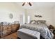 Main bedroom with a king-size bed and wooden dresser at 3220 Cherry Hill S Cir, Lakeland, FL 33810