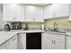 Kitchen corner sink with granite countertop and white cabinets at 3220 Cherry Hill S Cir, Lakeland, FL 33810