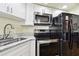 Kitchen with stainless steel appliances and granite countertops at 3220 Cherry Hill S Cir, Lakeland, FL 33810