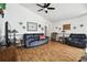 Living room with hardwood floors and comfortable seating at 3220 Cherry Hill S Cir, Lakeland, FL 33810