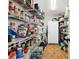 Well-stocked pantry with ample shelving for storage at 3220 Cherry Hill S Cir, Lakeland, FL 33810