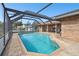 Inviting screened pool with spacious patio at 3220 Cherry Hill S Cir, Lakeland, FL 33810