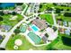 Aerial view of pool, clubhouse, tennis court, shuffleboard, and putting green at 3273 Pebble Bend Dr, Lakeland, FL 33810