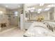 Bathroom with granite double vanity, large shower and skylight at 3273 Pebble Bend Dr, Lakeland, FL 33810