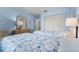 Bedroom with twin beds, dresser, and light blue walls at 3273 Pebble Bend Dr, Lakeland, FL 33810