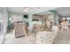 Dining area with glass top table and chairs, overlooking living room and kitchen at 3273 Pebble Bend Dr, Lakeland, FL 33810