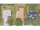 Three houses seen from above; showcasing rooftops and yards at 3445 Sleepy Hill Oaks St, Lakeland, FL 33810