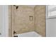 Bathroom with shower/tub combo and tile surround at 3445 Sleepy Hill Oaks St, Lakeland, FL 33810