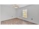 Well-lit bedroom with ceiling fan and wood flooring at 3445 Sleepy Hill Oaks St, Lakeland, FL 33810