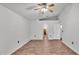 Primary bedroom with wood flooring and access to bathroom at 3445 Sleepy Hill Oaks St, Lakeland, FL 33810