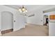 Light-filled dining area with tile floors and chandelier at 3445 Sleepy Hill Oaks St, Lakeland, FL 33810