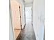 Clean hallway with carpeted flooring and access to bedrooms at 351 Cloverdale Rd, Winter Haven, FL 33884