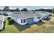 Aerial view of a single-story home with a gray roof and white exterior, situated in a residential neighborhood at 3618 Highland Fairways Blvd, Lakeland, FL 33810