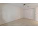 Simple bedroom with ceiling fan and double doors at 3618 Highland Fairways Blvd, Lakeland, FL 33810