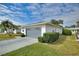 Single-story home with an attached garage and well-manicured landscaping at 3618 Highland Fairways Blvd, Lakeland, FL 33810