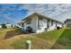 Rear view of house showcasing a well-maintained lawn at 3618 Highland Fairways Blvd, Lakeland, FL 33810