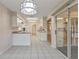 Kitchen features white cabinetry and tile floors at 3618 Highland Fairways Blvd, Lakeland, FL 33810