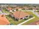 Aerial view of house, showcasing its tile roof, and location within a community at 4003 Solamor St, Lakeland, FL 33810