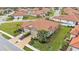 Aerial view of single Gathering home with two car garage and lush landscaping at 4003 Solamor St, Lakeland, FL 33810