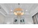 Close up of a coffered ceiling with an elegant chandelier at 4003 Solamor St, Lakeland, FL 33810