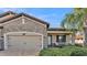 Inviting exterior with stone accents and a two-car garage at 4003 Solamor St, Lakeland, FL 33810