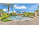 Resort-style pool with palm trees and lush landscaping at 4003 Solamor St, Lakeland, FL 33810