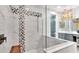 Walk-in shower with marble tile and built-in seat at 4003 Solamor St, Lakeland, FL 33810