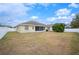 House backyard with screened patio and fenced yard at 4009 Oakley Way, Lakeland, FL 33813