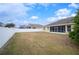 Fenced backyard of home with screened patio at 4009 Oakley Way, Lakeland, FL 33813