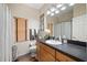 Bathroom with dark brown vanity and white sink at 4009 Oakley Way, Lakeland, FL 33813