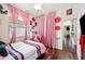 Bright bedroom with pink curtains and striped bedding at 4009 Oakley Way, Lakeland, FL 33813