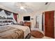 Bright bedroom featuring a king-size bed, and a walk-in closet at 4009 Oakley Way, Lakeland, FL 33813