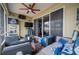 Relaxing screened porch with Dallas Cowboys decor at 4009 Oakley Way, Lakeland, FL 33813