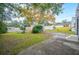 Large backyard with detached garage and a grassy area at 401 E Belmar St, Lakeland, FL 33803