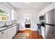 Modern kitchen featuring white cabinets and hardwood floors at 401 E Belmar St, Lakeland, FL 33803