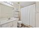 Clean bathroom with white vanity, shower/tub combo, and updated fixtures at 4048 Windchime Ln, Lakeland, FL 33811