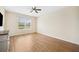 Spacious bedroom with hardwood floors and a large window at 4048 Windchime Ln, Lakeland, FL 33811