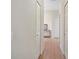 Clean hallway with hardwood floors and neutral paint at 4048 Windchime Ln, Lakeland, FL 33811