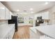 Modern kitchen with white cabinets, stainless steel appliances, and light countertops at 4048 Windchime Ln, Lakeland, FL 33811