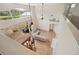 High-angle view of living room with hardwood floors and a large window at 4048 Windchime Ln, Lakeland, FL 33811