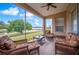 Relaxing screened porch overlooking a tranquil lake, perfect for outdoor enjoyment at 4048 Windchime Ln, Lakeland, FL 33811